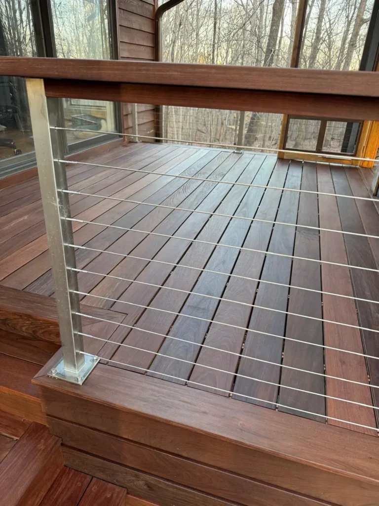 Dark brown wooden Deck after being stained by Alba Pro Services