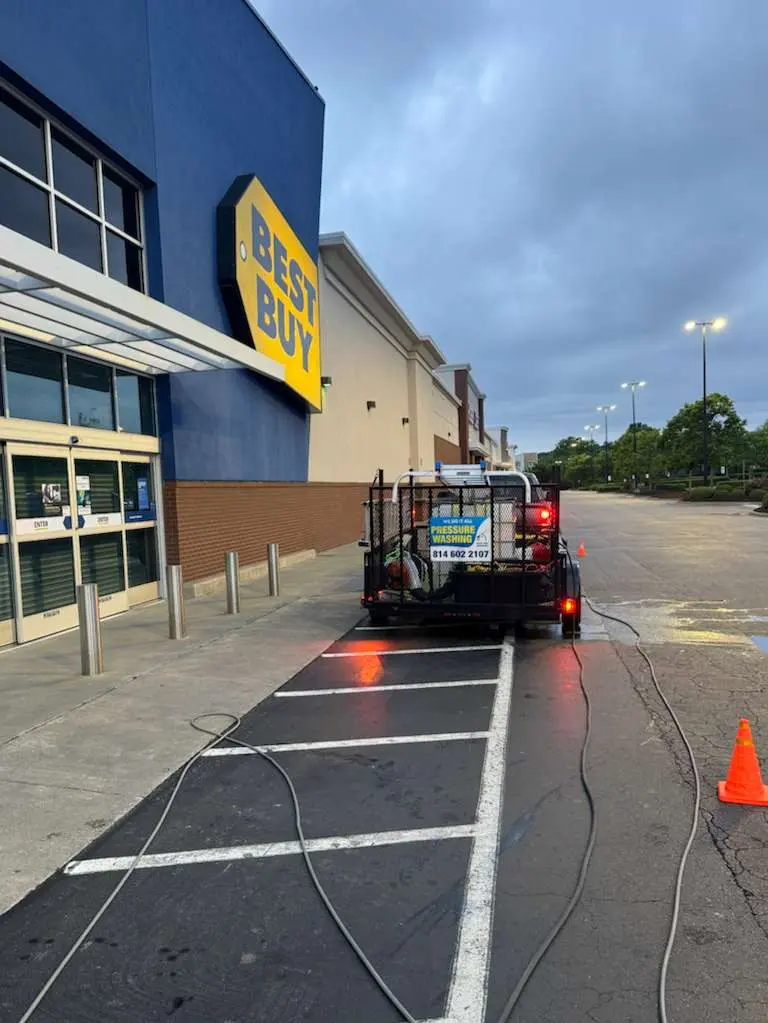 Alba Pro Services Pressure washing the exterior of a Best Buy